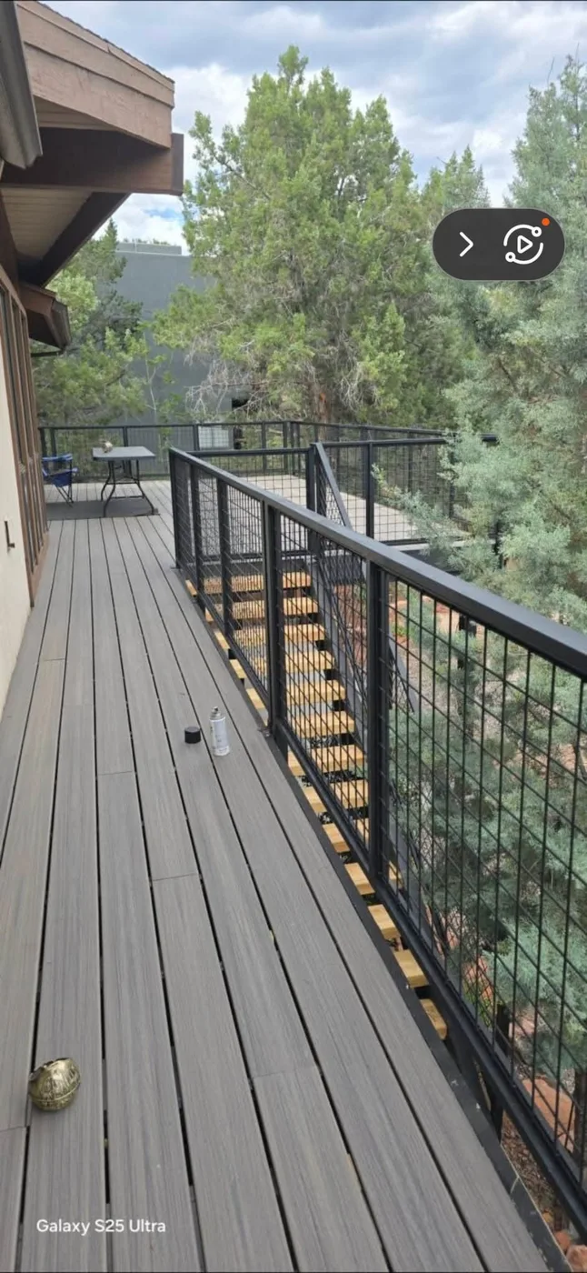 Deck with cable railing overlooking trees