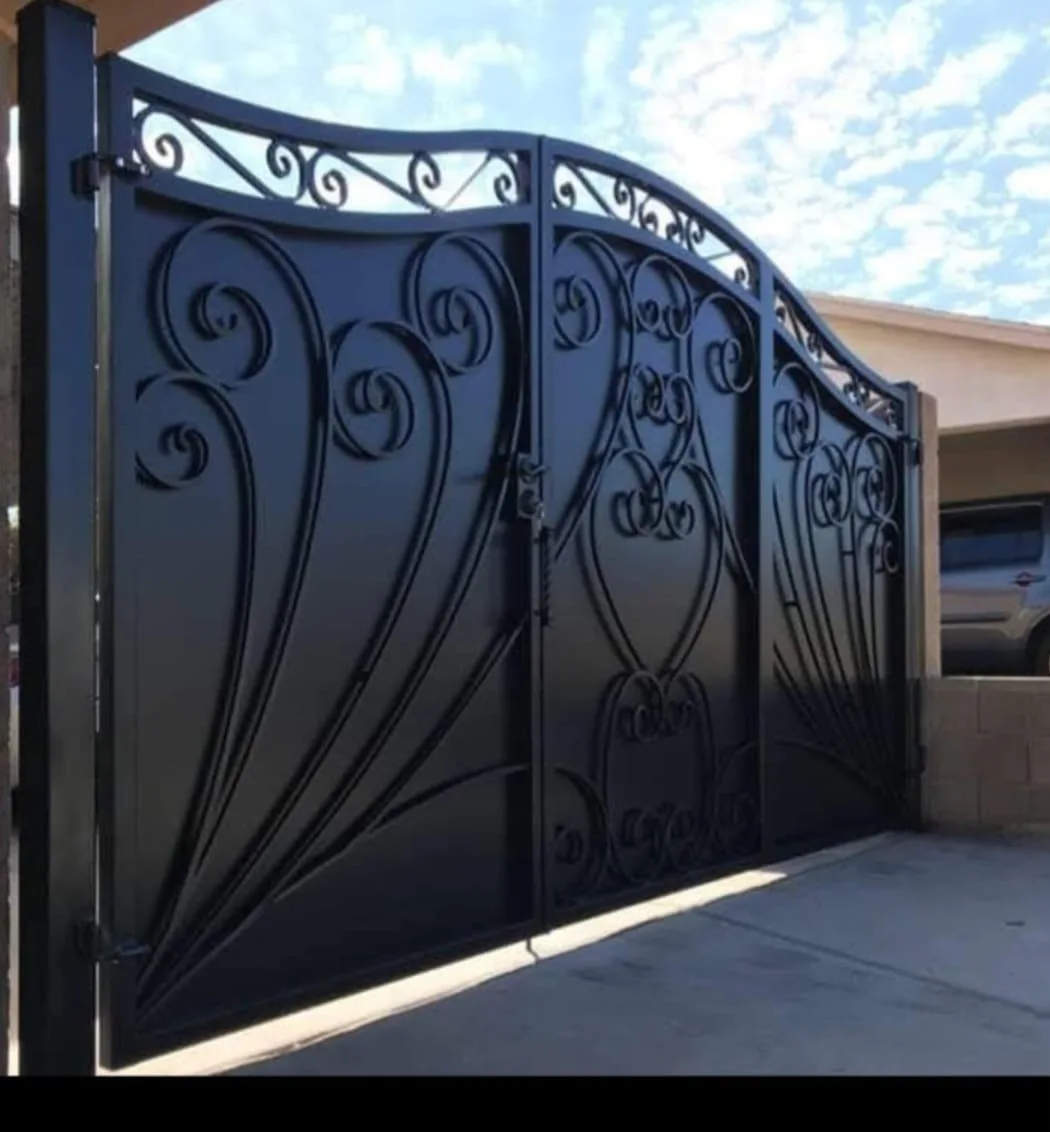 Ornamental iron double gate with scrollwork