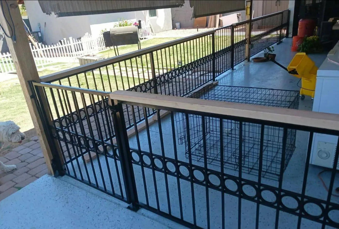 Iron rail fence beside a pool deck