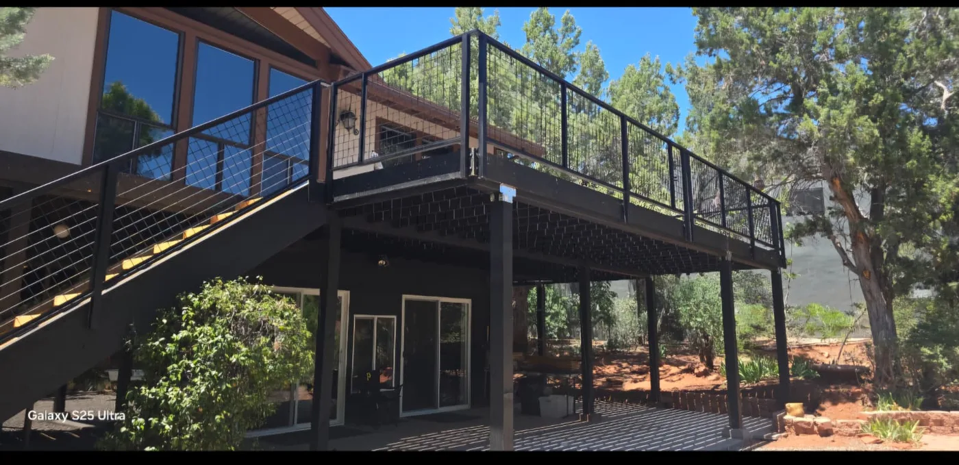 Composite deck with black steel railings we built